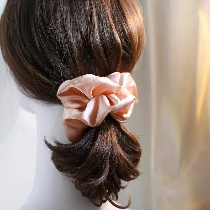 Large smooth satin hair tie with smooth lightweight texture and elegant oversized design