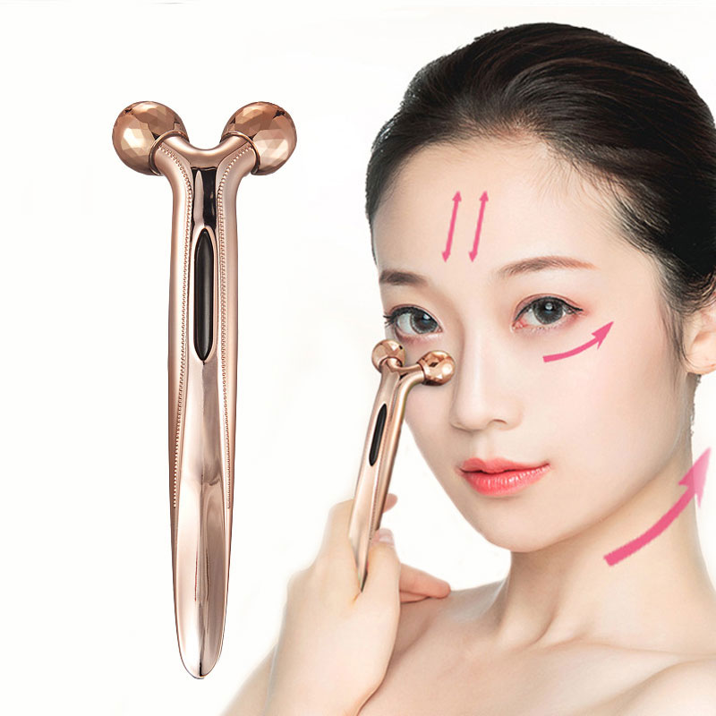 Woman using 3D facial roller during skincare routine