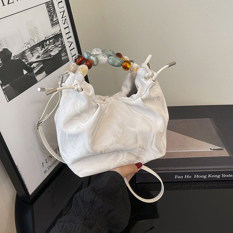 Women’s pleated minimalist pearl crossbody bag with square shape for everyday elegance