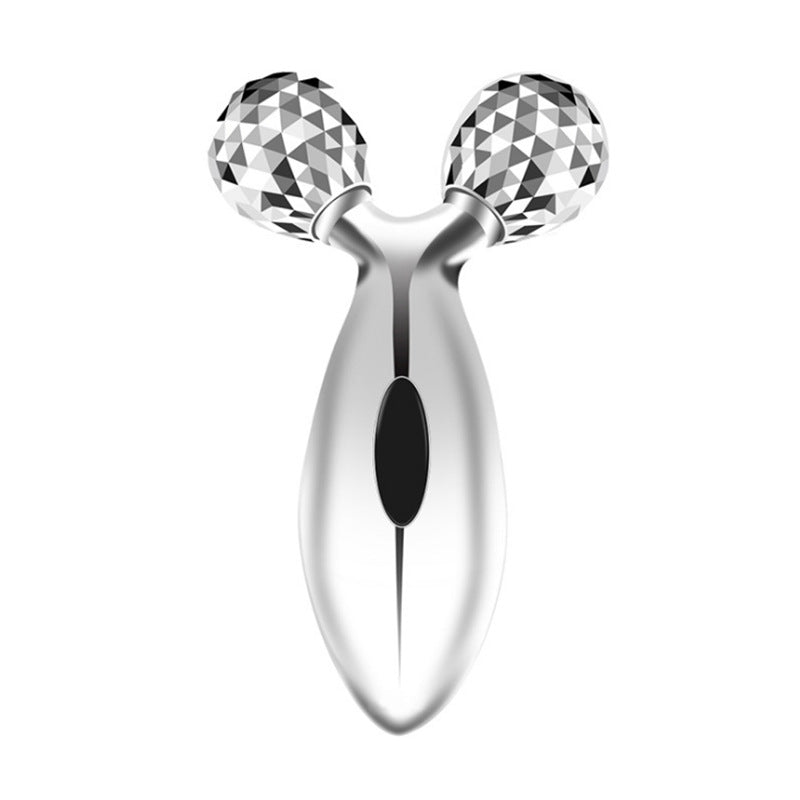 Silver facial roller with crystal-like ends on a white background