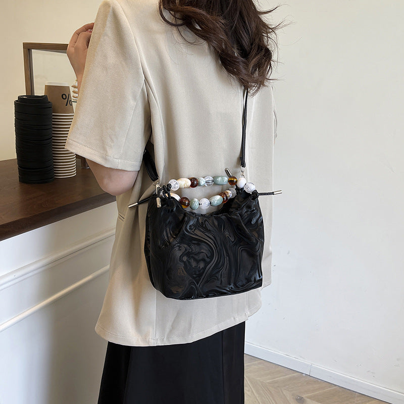 Women’s pleated minimalist pearl crossbody bag with square shape for everyday elegance