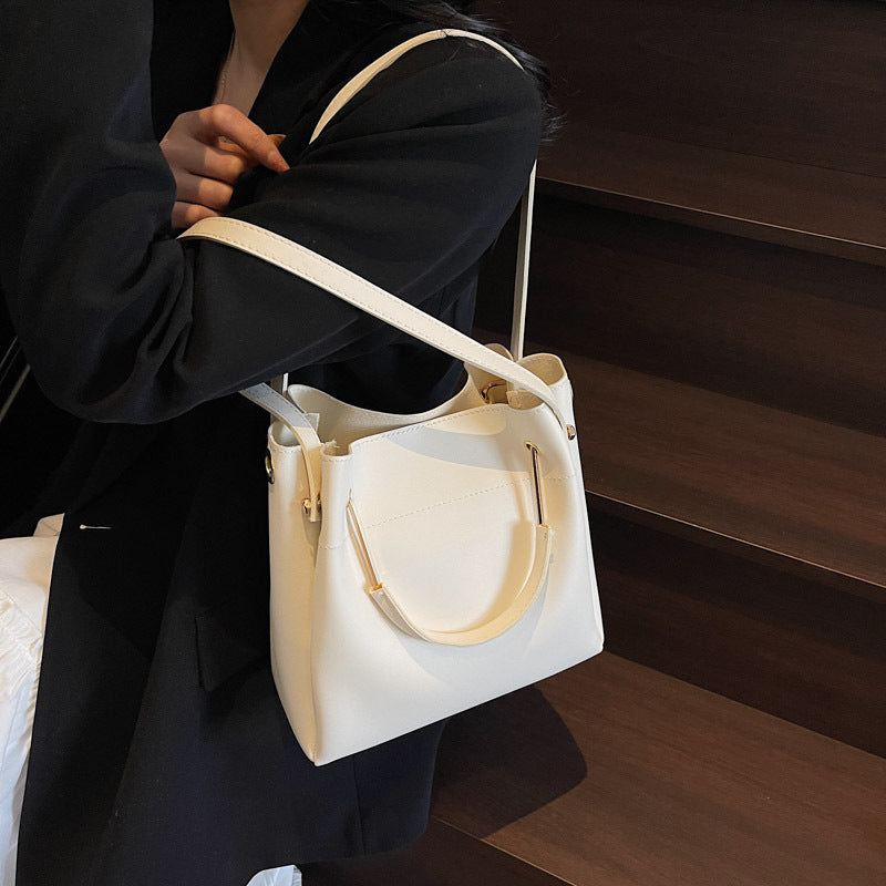 White minimalist bucket bag with clean all-match design