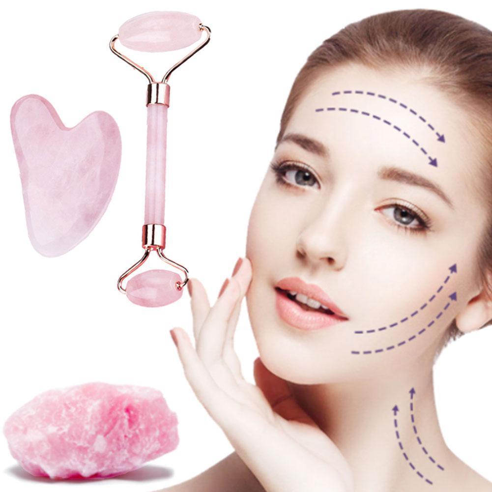 Facial gua sha and roller set displayed on minimalist vanity