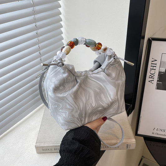 Women’s pleated minimalist pearl crossbody bag with square shape for everyday elegance