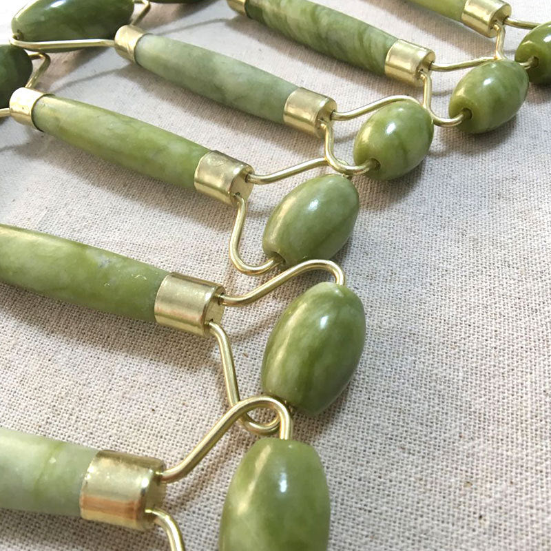 Double-end jade roller beauty tool close up