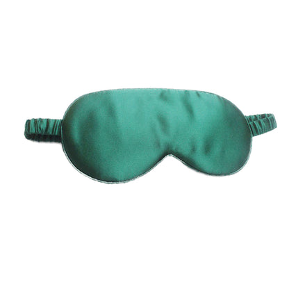Green satin sleep mask on a white background