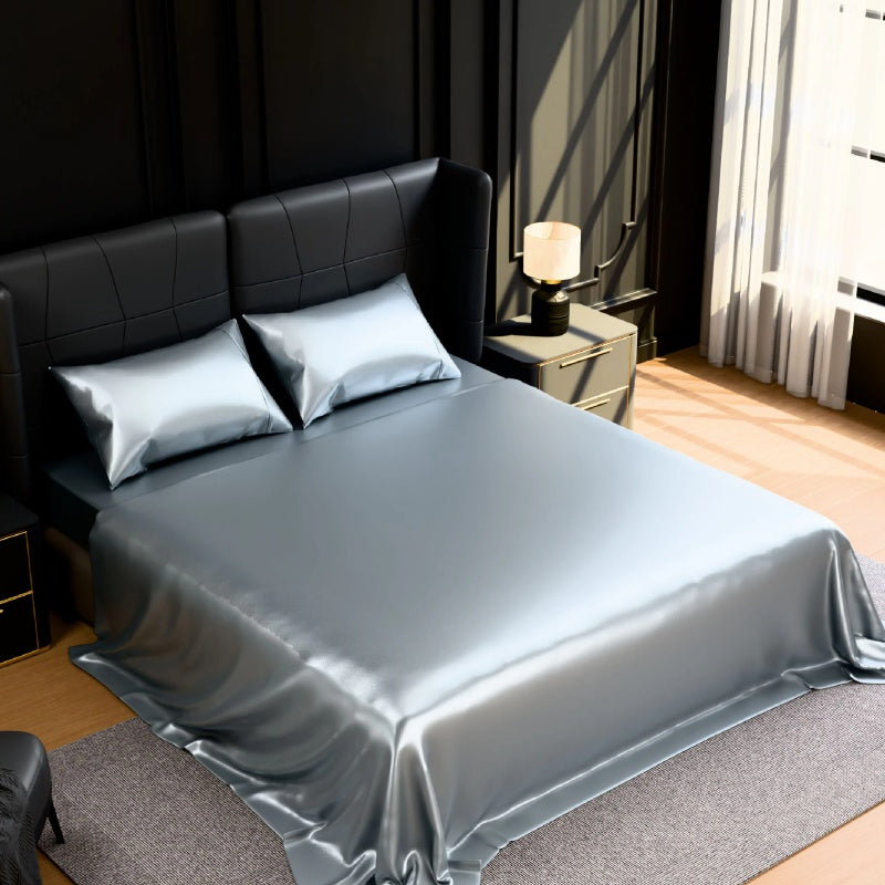 Modern bedroom styled with grey satin king sheets