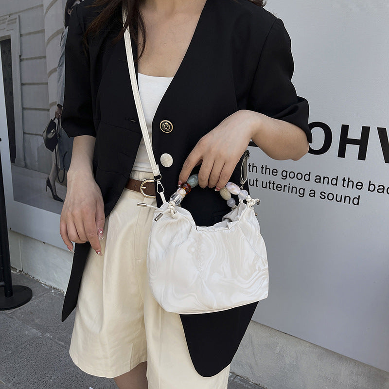 Women’s pleated minimalist pearl crossbody bag with square shape for everyday elegance