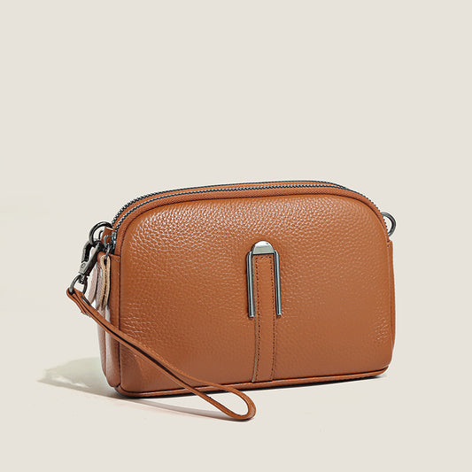 Minimalist top-grain leather crossbody bag with adjustable strap for everyday wear”