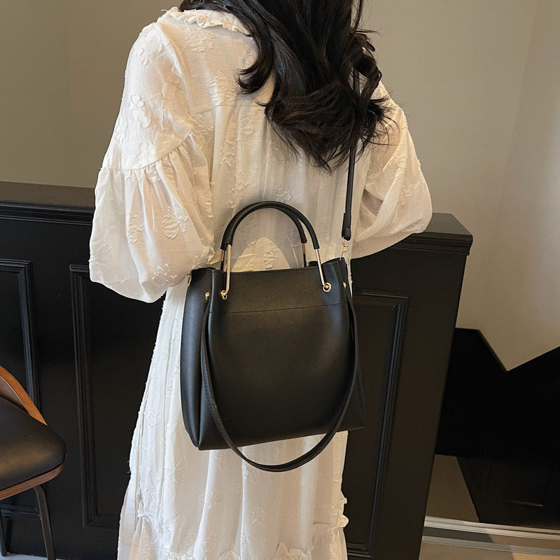 Black minimalist bucket shoulder bag for everyday wear