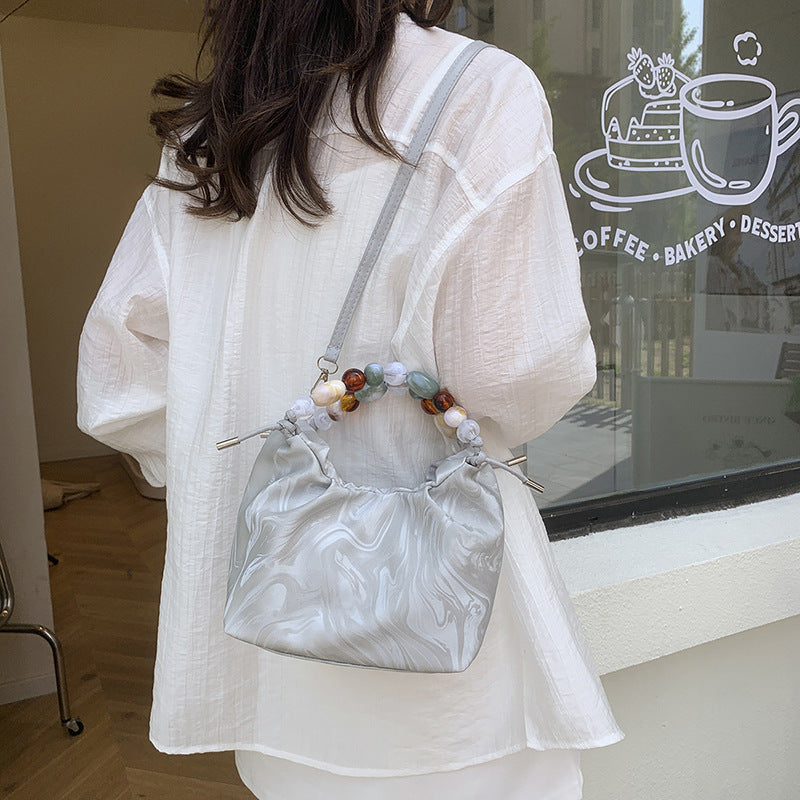 Women’s pleated minimalist pearl crossbody bag with square shape for everyday elegance