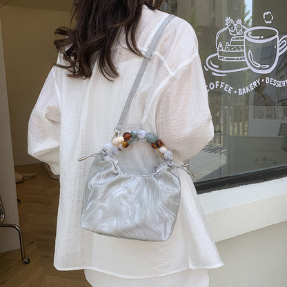 Women’s pleated minimalist pearl crossbody bag with square shape for everyday elegance