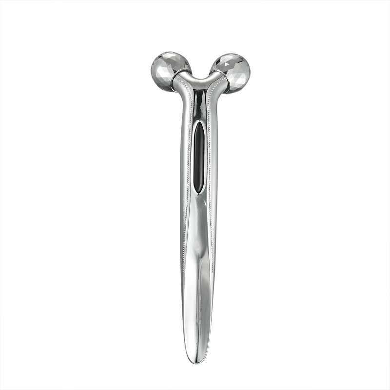 Silver facial massager on a white background
