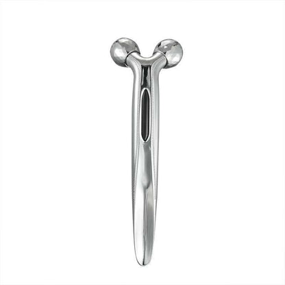 Silver facial massager on a white background