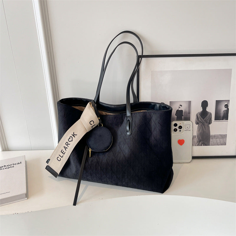 Everyday tote shoulder bag styled for casual travel and errands