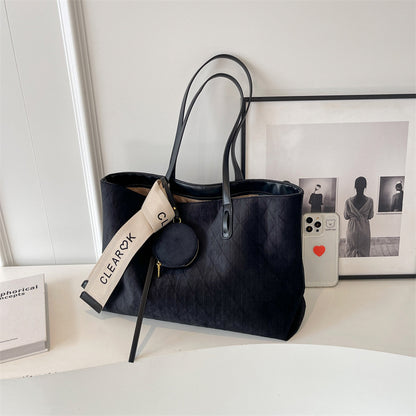 Everyday tote shoulder bag styled for casual travel and errands