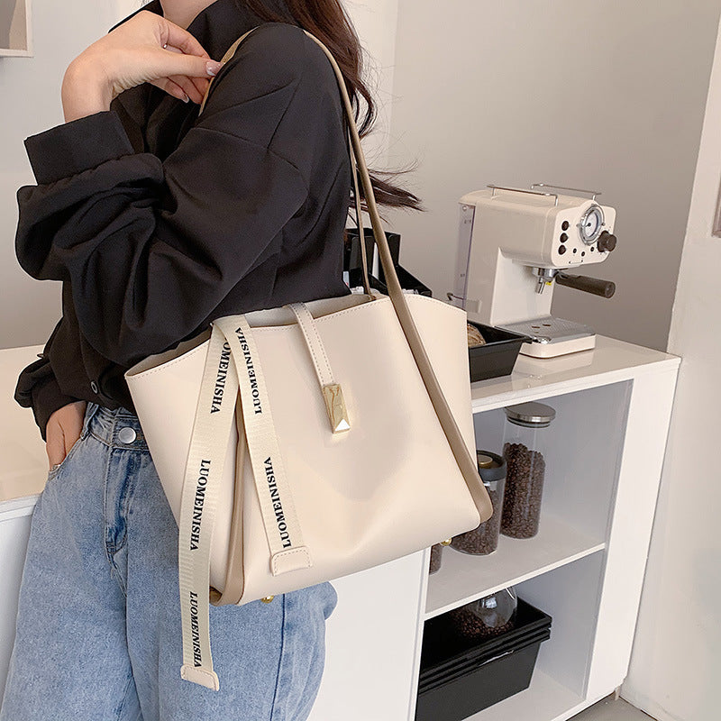 Beige large capacity commuter tote bag with clean minimalist look