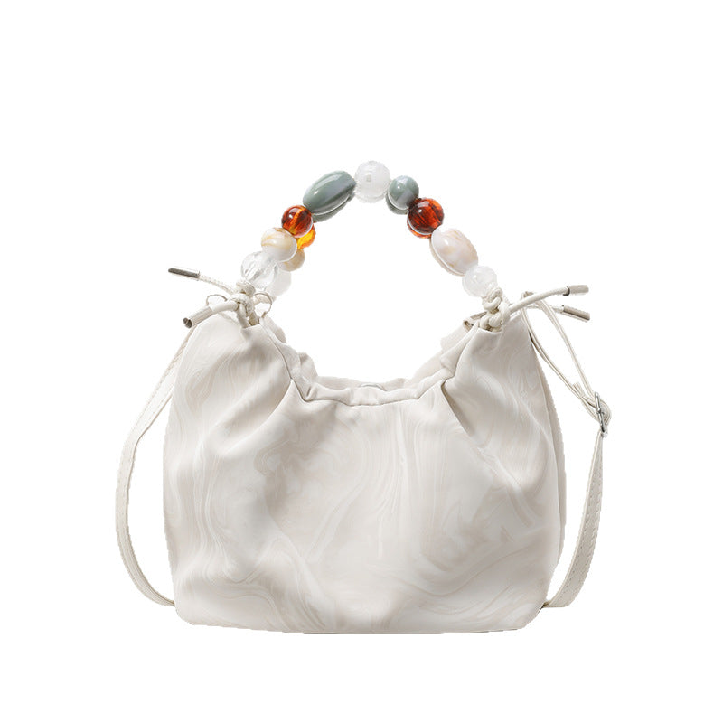 Women’s pleated minimalist pearl crossbody bag with square shape for everyday elegance