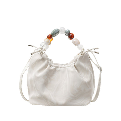 Women’s pleated minimalist pearl crossbody bag with square shape for everyday elegance