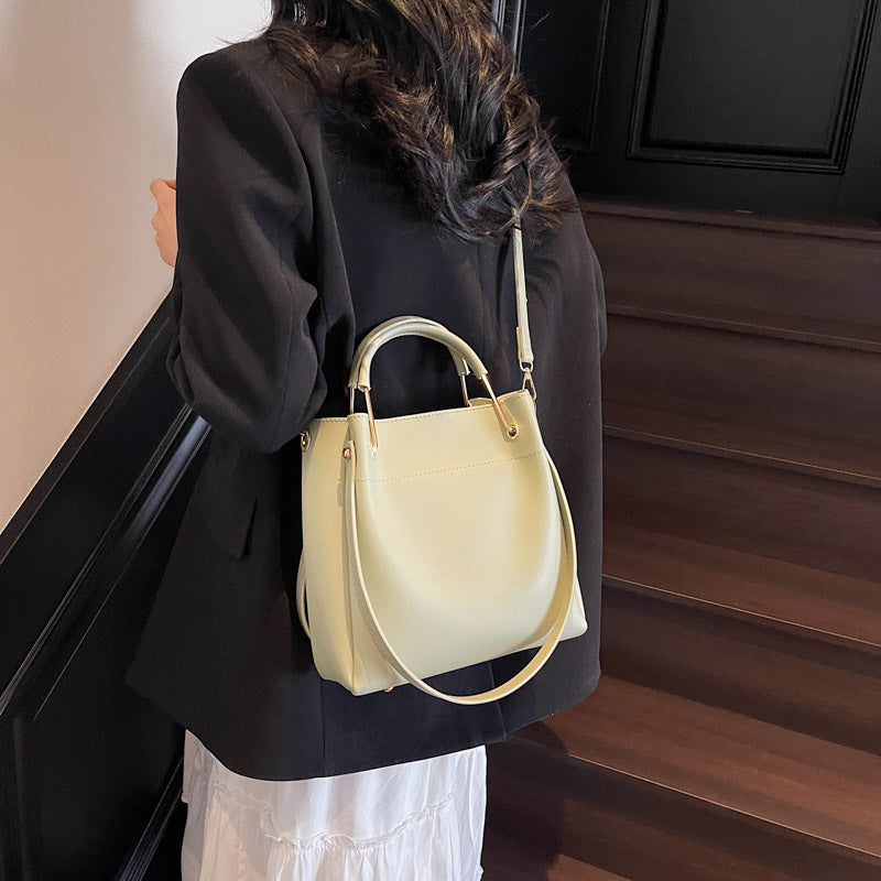 White minimalist bucket bag with clean all-match design