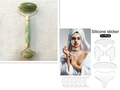 Facial roller, woman with towel on head, and silicone stickers on a white background